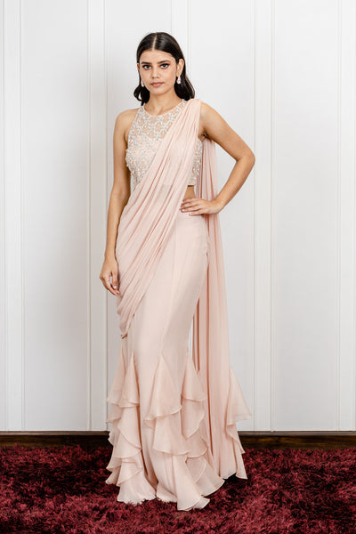 Ruffled Skirt Saree with a Side Drape And a Pearl Dropped Blouse